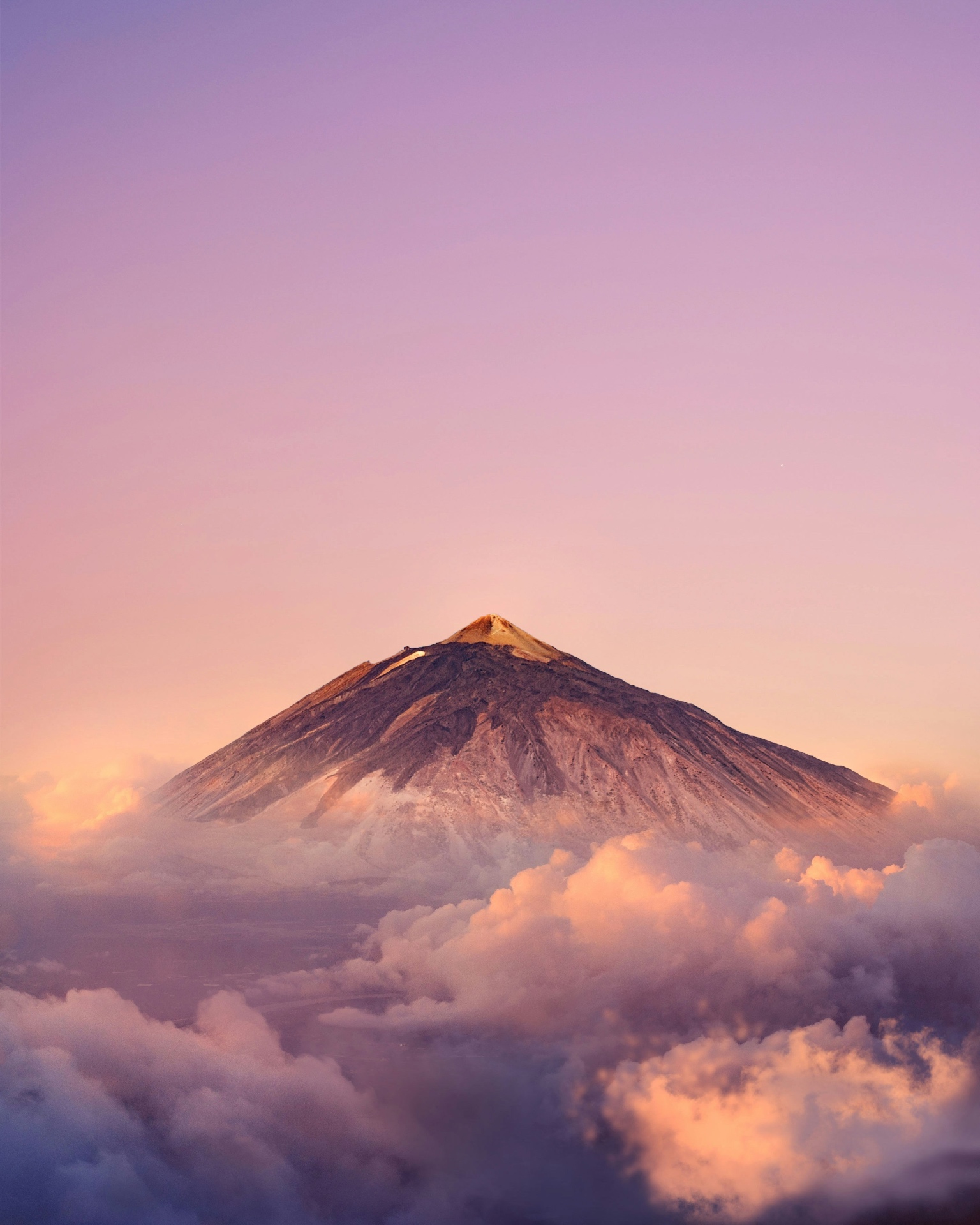 Mount Teide at sunset above the clouds in Tenerife